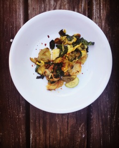 Sauteed squash over pan fried grit cakes
